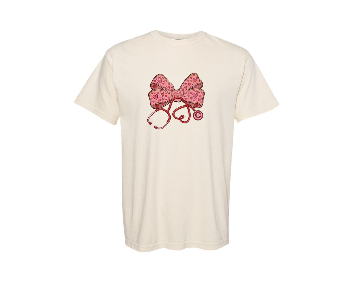 brand:Comfort Colors|color:Ivory|Valentine Nurse Stethoscope Coquette Bow Graphic T-Shirt