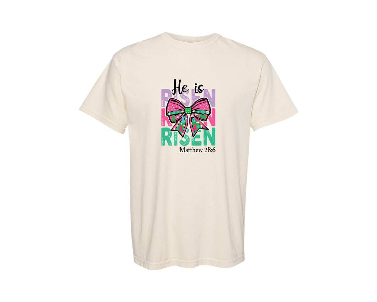 brand:Comfort Colors|color:Ivory|He Is Risen Bow Easter Christian Graphic T-Shirt