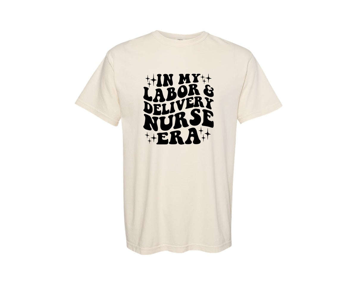 brand:Comfort Colors|color:Ivory|In My Labor And Delivery Nurse Era 2 Graphic T-Shirt