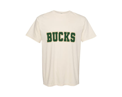 brand:Comfort Colors|color:Ivory|Bucks Varsity Curved Green Gold Graphic T-Shirt