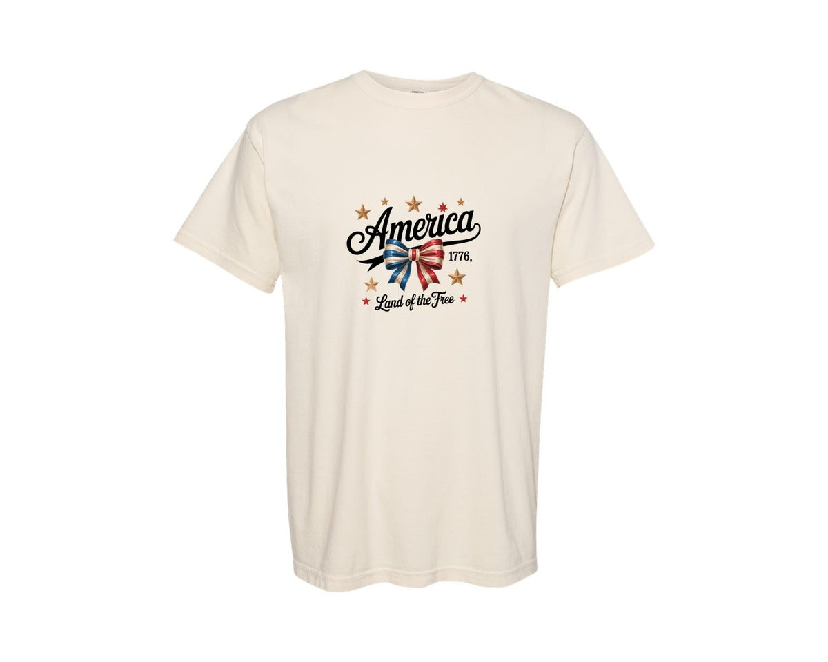 brand:Comfort Colors|color:Ivory|Patriotic Ribbon Bow With Gold Stars Graphic T-Shirt