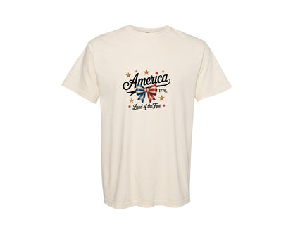 brand:Comfort Colors|color:Ivory|Patriotic Ribbon Bow With Gold Stars Graphic T-Shirt