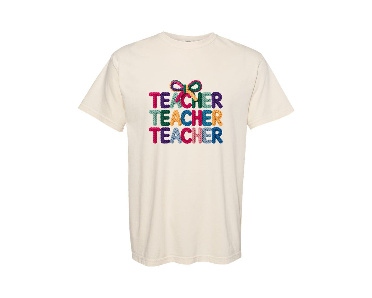 brand:Comfort Colors|color:Ivory|Knitted Coquette Teacher Typography Graphic T-Shirt