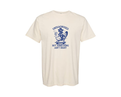 brand:Comfort Colors|color:Ivory|Undiagnosed Cowboy Raccoon With Chicken Graphic T-Shirt