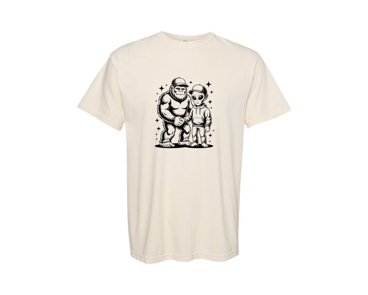 brand:Comfort Colors|color:Ivory|Alien Bigfoot Hand Shake Cryptid Funny Graphic T-Shirt