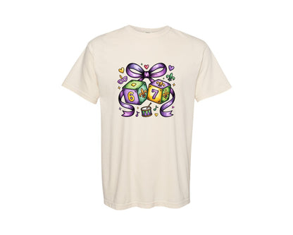 brand:Comfort Colors|color:Ivory|Mardi Gras 6 7 Dice Brushstroke Bow Graphic T-Shirt