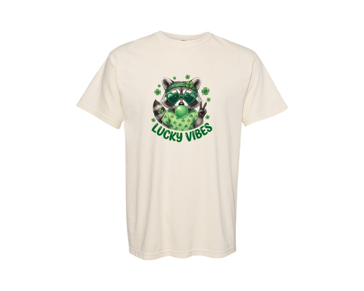 brand:Comfort Colors|color:Ivory|Lucky Vibes Raccoon St Patrick Graphic T-Shirt