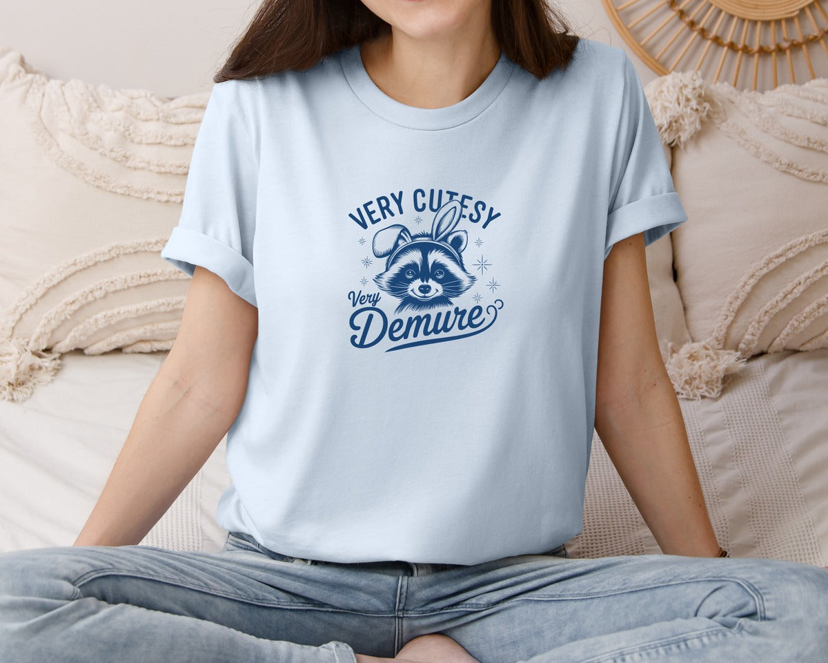 brand:Bella Canvas|color:Light Blue|Very Cutesy Very Demure Raccoon T Shirt Graphic T-Shirt