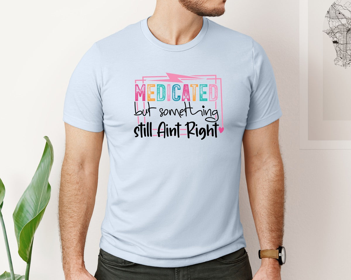 brand:Bella Canvas|color:Light Blue|Medicated But Somethin Aint Right Snarky Graphic T-Shirt