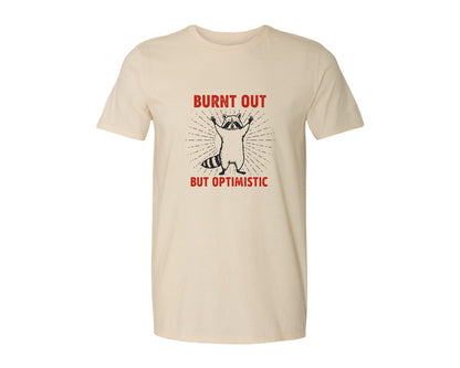brand:Generic|color:Light Cream / Natural|Burnt Out But Optimistic Raccoon Graphic T-Shirt