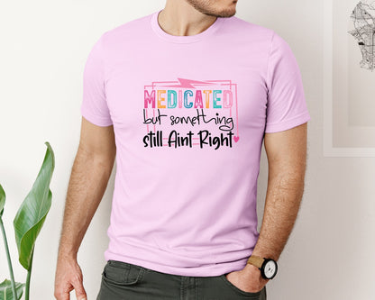 brand:Bella Canvas|color:Lilac|Medicated But Somethin Aint Right Snarky Graphic T-Shirt