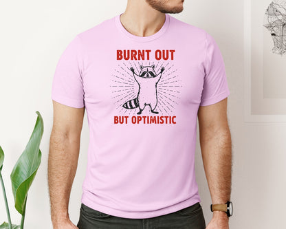 brand:Bella Canvas|color:Lilac|Burnt Out But Optimistic Raccoon Graphic T-Shirt