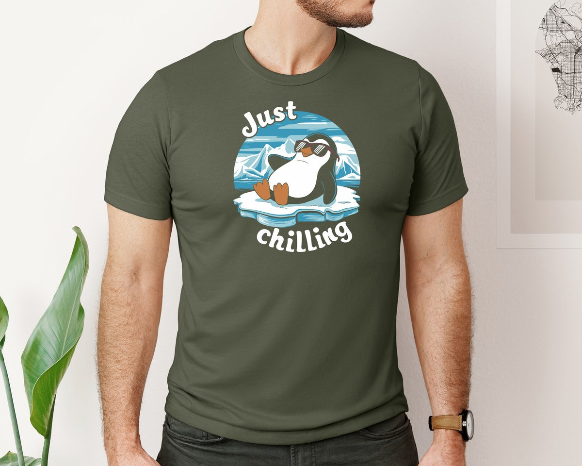 brand:Bella Canvas|color:Military Green|Just Chilling Penguin Pun Relaxed Vibes Graphic T-Shirt