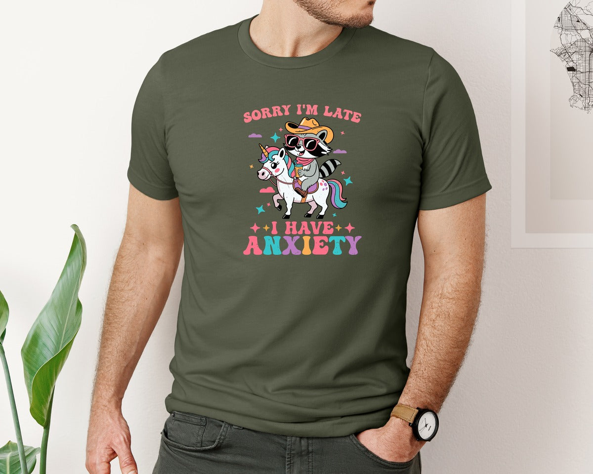 brand:Bella Canvas|color:Military Green|Funny Raccoon Riding Unicorn Meme Graphic T-Shirt