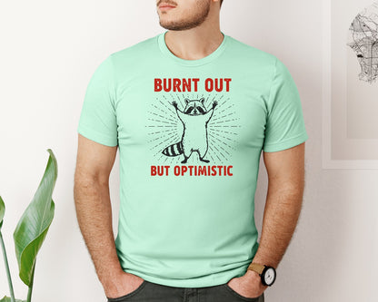 brand:Bella Canvas|color:Mint|Burnt Out But Optimistic Raccoon Graphic T-Shirt