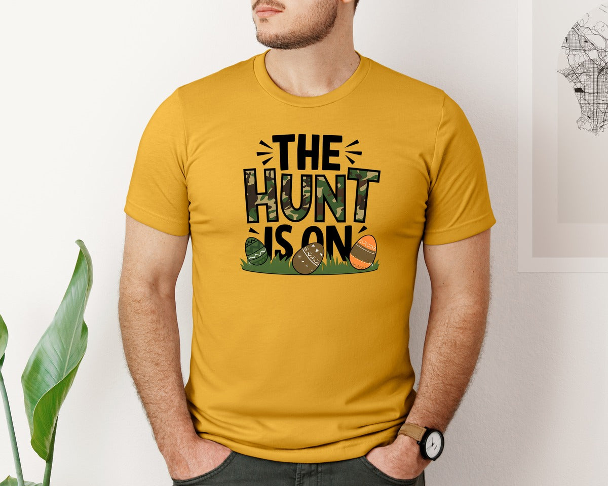 brand:Bella Canvas|color:Mustard|The Hunt Is On Camo Easter Egg Camo Graphic T-Shirt