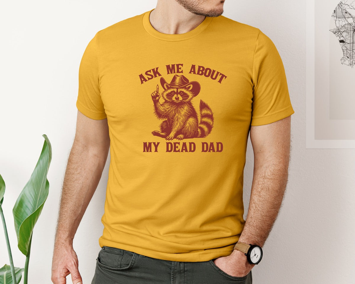 brand:Bella Canvas|color:Mustard|Dead Dad Club Unhinged Meme Raccoon Graphic T-Shirt