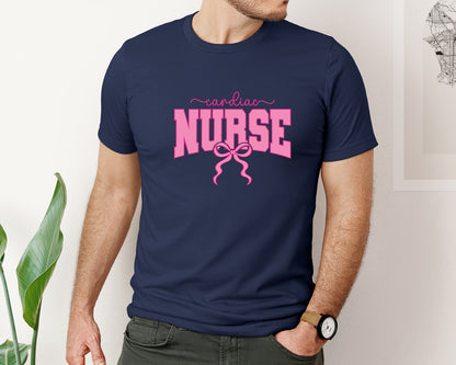 brand:Bella Canvas|color:Navy|Cardiac Nurse Coquette Nurse Pink Bow Graphic T-Shirt
