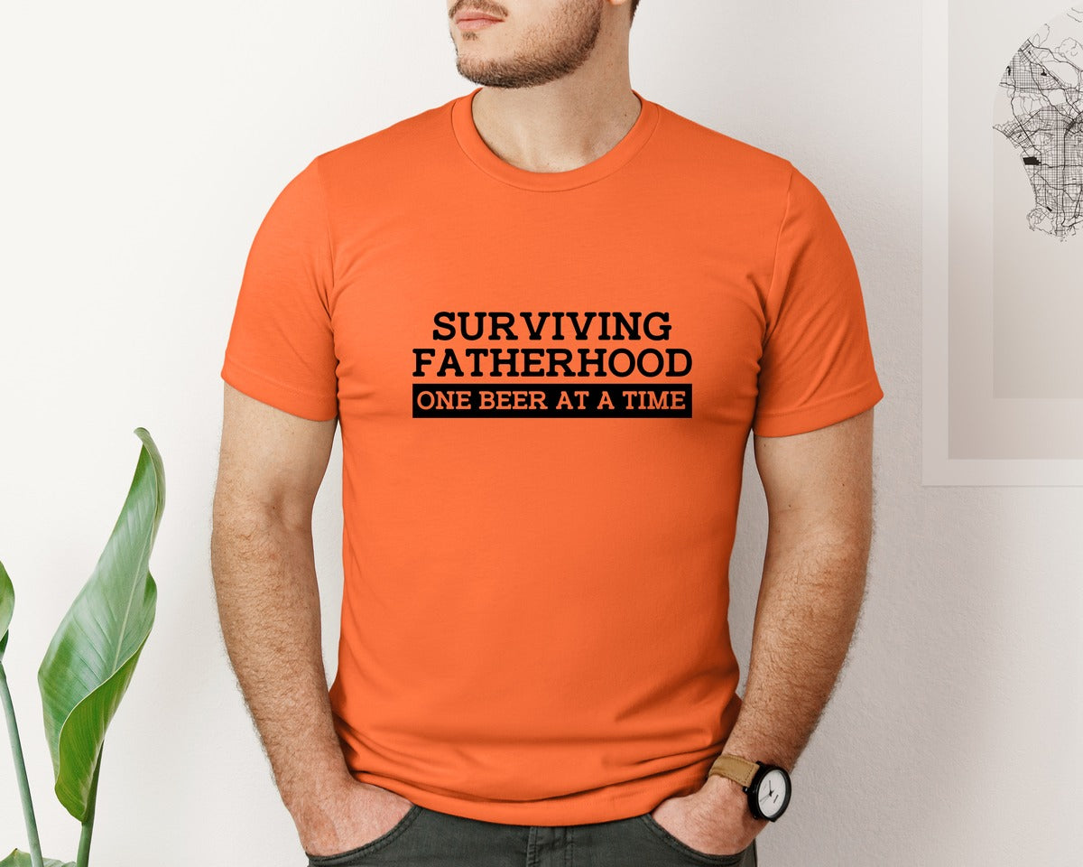 brand:Bella Canvas|color:Orange|Surviving Fatherhood Mens T Shirt Graphic T-Shirt