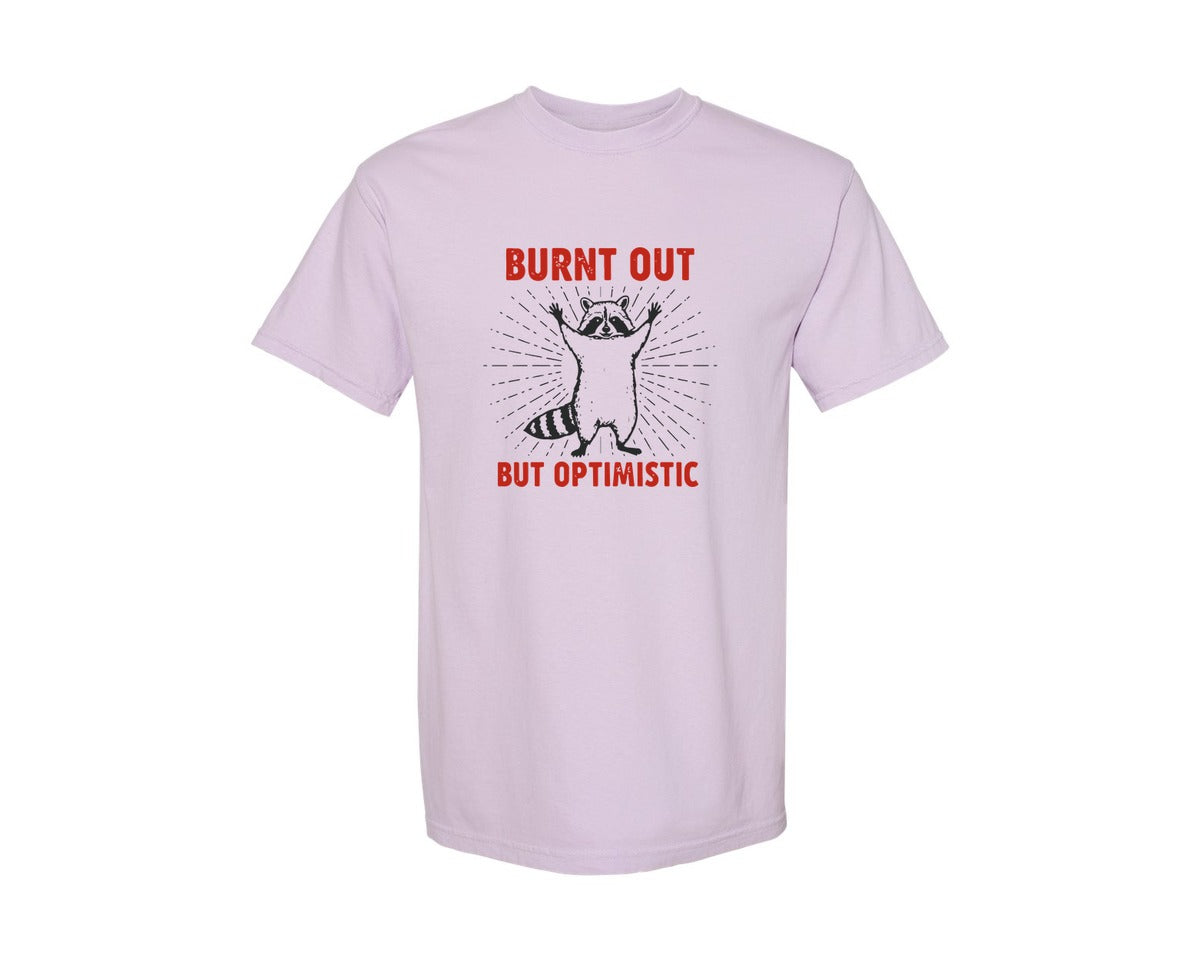 brand:Comfort Colors|color:Orchid|Burnt Out But Optimistic Raccoon Graphic T-Shirt