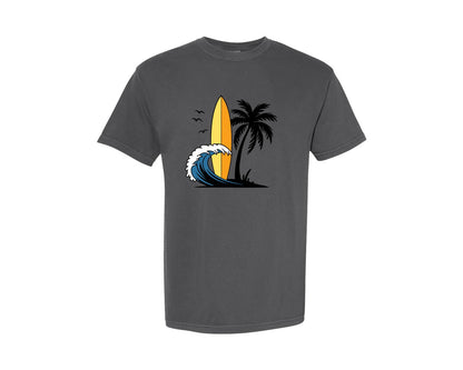 brand:Comfort Colors|color:Pepper|Surfboard With Ocean Wave And Palm Tree Graphic T-Shirt