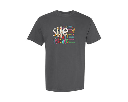 brand:Comfort Colors|color:Pepper|She Is Teacher Bible Verse Teacher Graphic T-Shirt