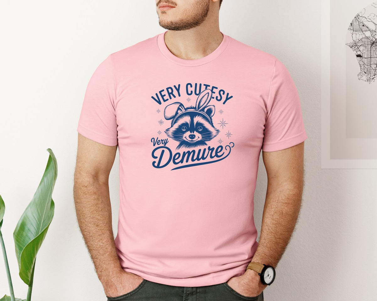 brand:Bella Canvas|color:Pink|Very Cutesy Very Demure Raccoon T Shirt Graphic T-Shirt