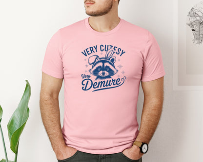 brand:Bella Canvas|color:Pink|Very Cutesy Very Demure Raccoon T Shirt Graphic T-Shirt