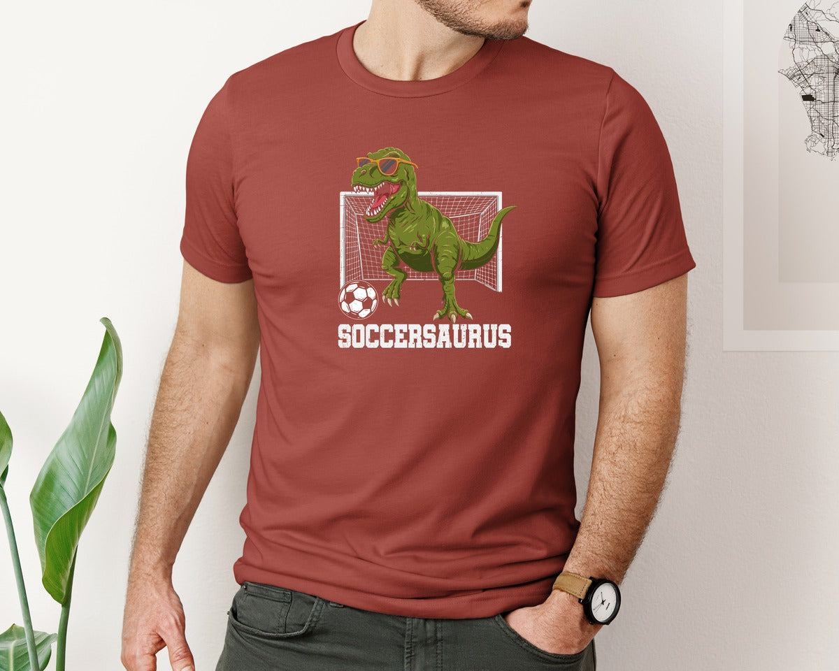 brand:Bella Canvas|color:Rust|T Rex Playing Soccer T Shirt Graphic T-Shirt
