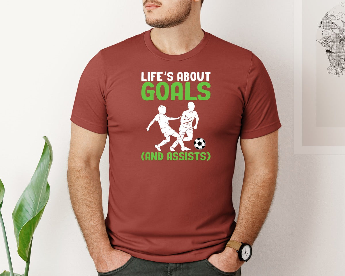brand:Bella Canvas|color:Rust|Lifes About Goals Soccer T Shirt Graphic T-Shirt