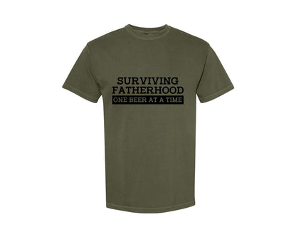 brand:Comfort Colors|color:Sage Green|Surviving Fatherhood Mens T Shirt Graphic T-Shirt