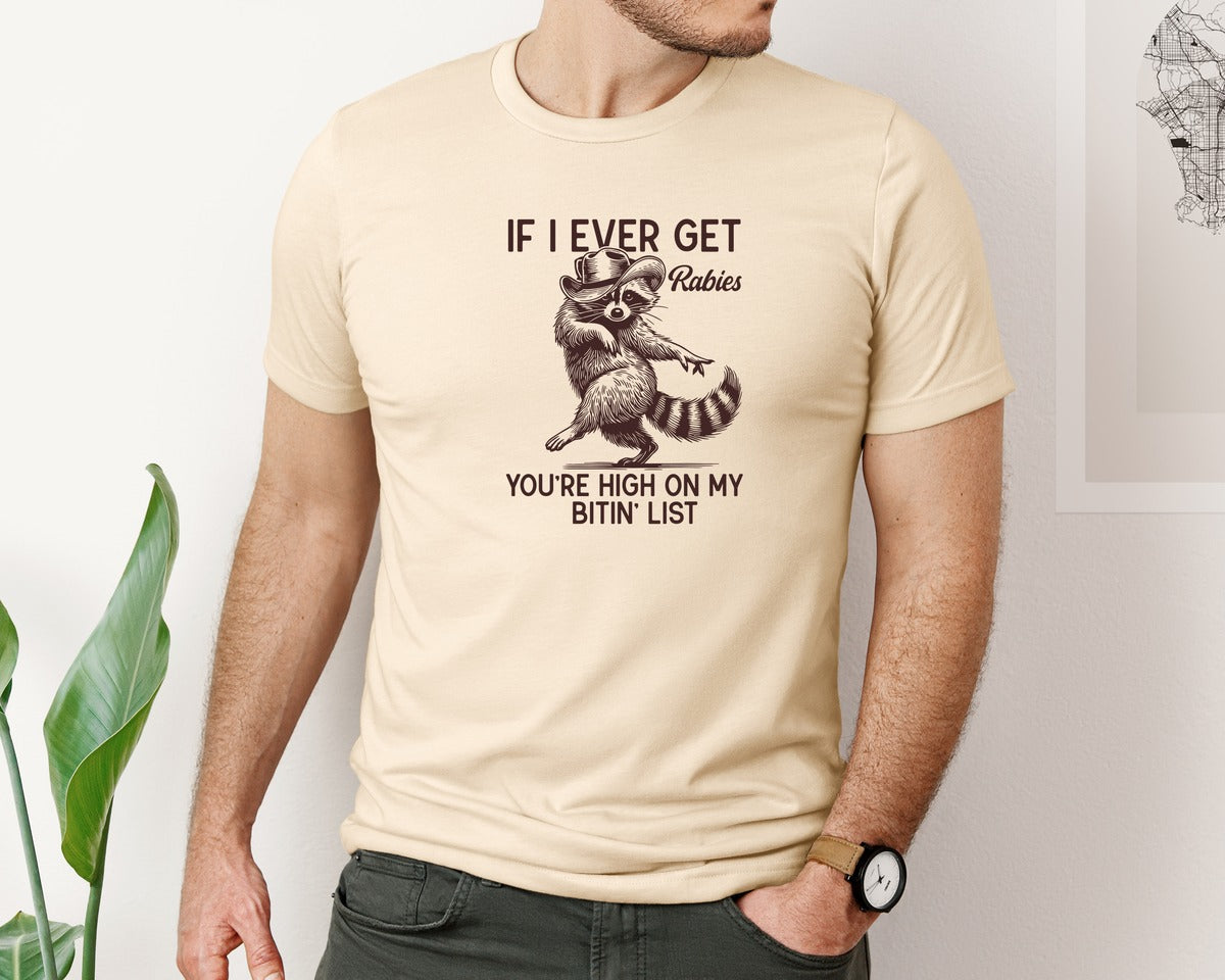 brand:Bella Canvas|color:Soft Cream|If I Ever Get Rabies Cowboy Raccoon Graphic T-Shirt