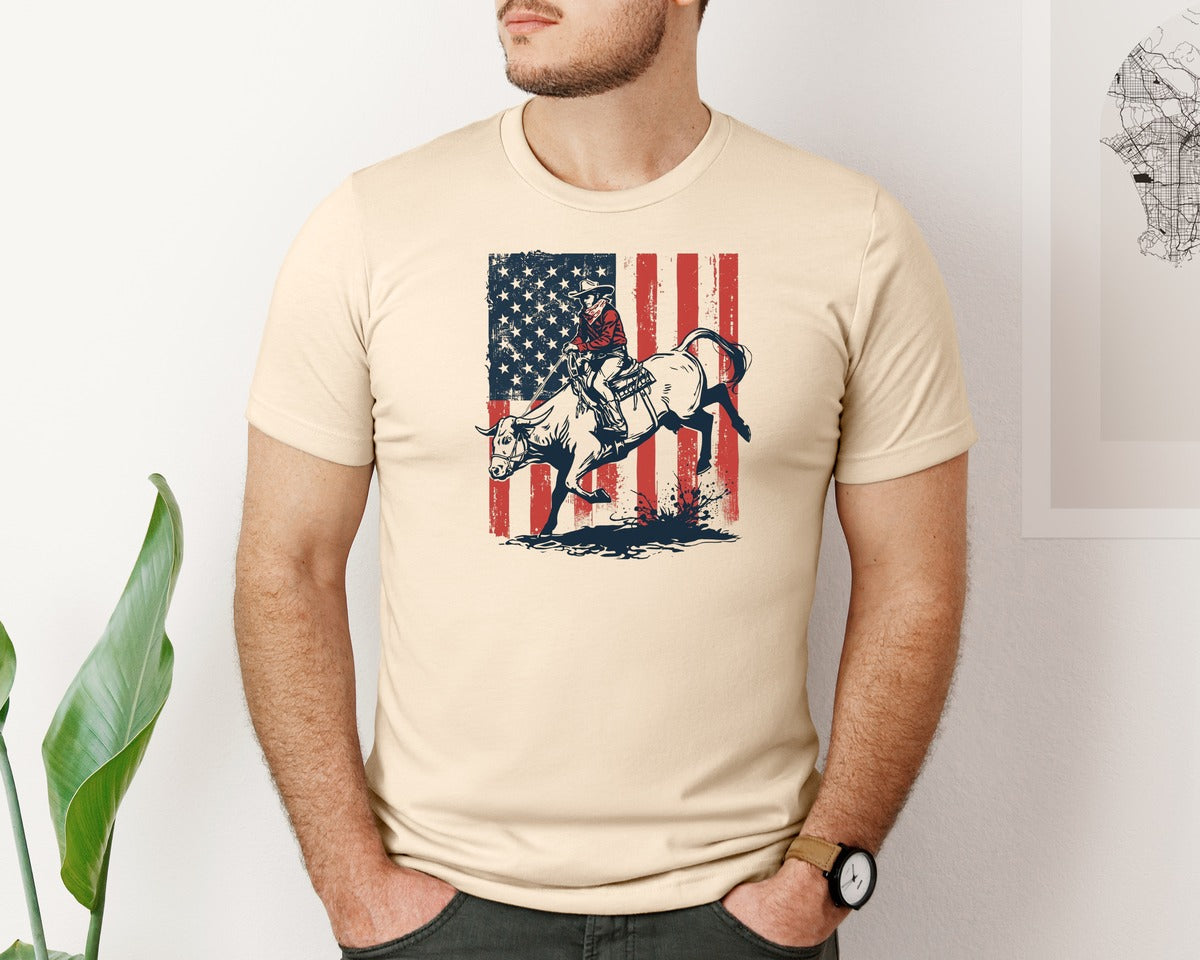 brand:Bella Canvas|color:Soft Cream|Patriotic Cowboy Bull Riding Graphic T-Shirt