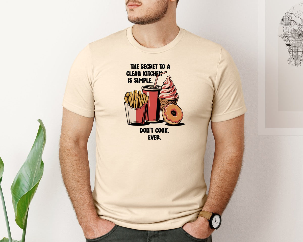 brand:Bella Canvas|color:Soft Cream|The Secret To A Clean Kitchen Sarcastic Graphic T-Shirt