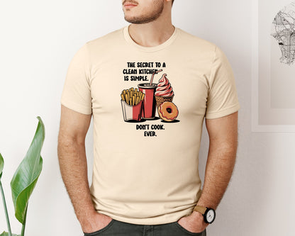brand:Bella Canvas|color:Soft Cream|The Secret To A Clean Kitchen Sarcastic Graphic T-Shirt