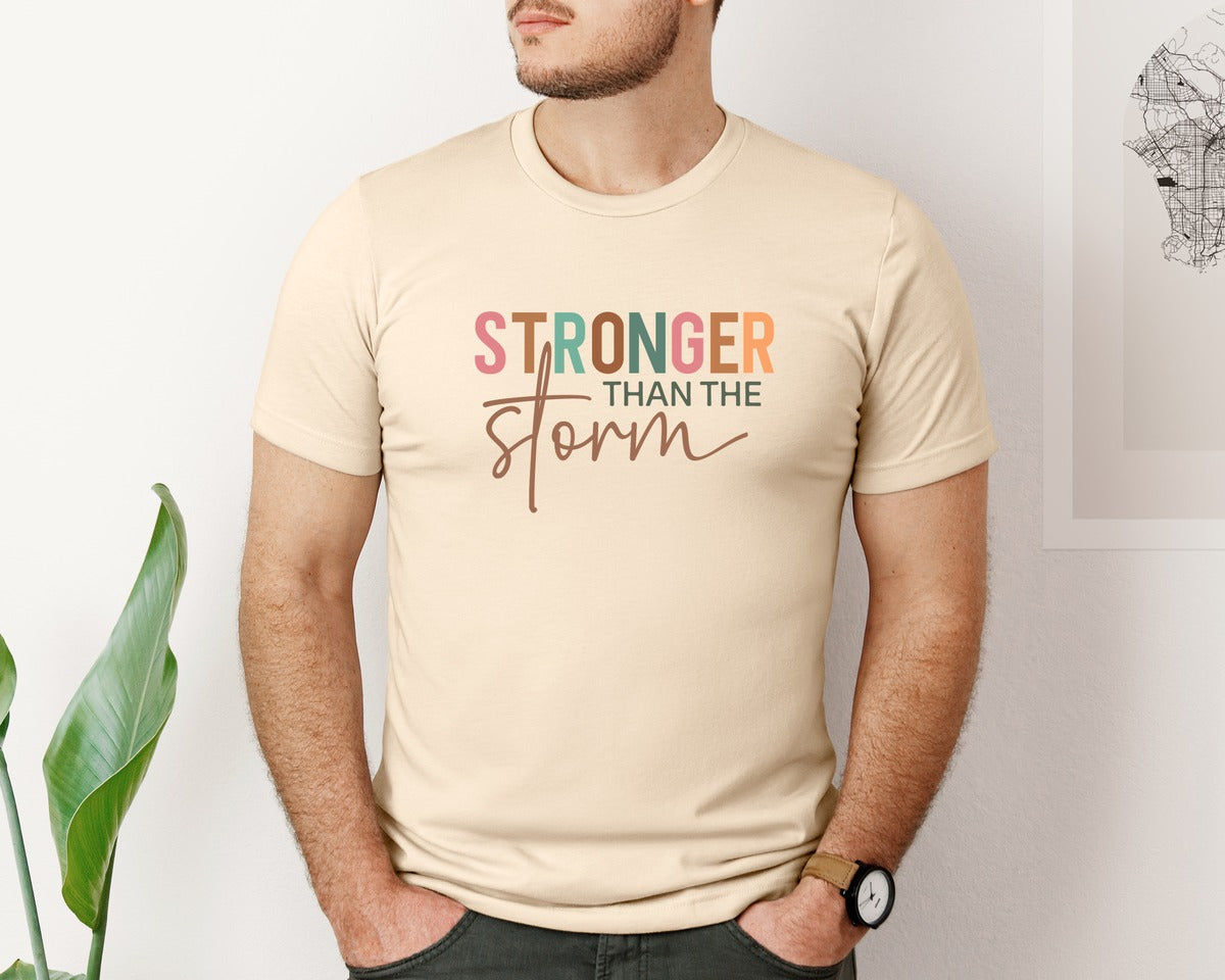 brand:Bella Canvas|color:Soft Cream|Stronger Than The Storm Bible Verse Graphic T-Shirt