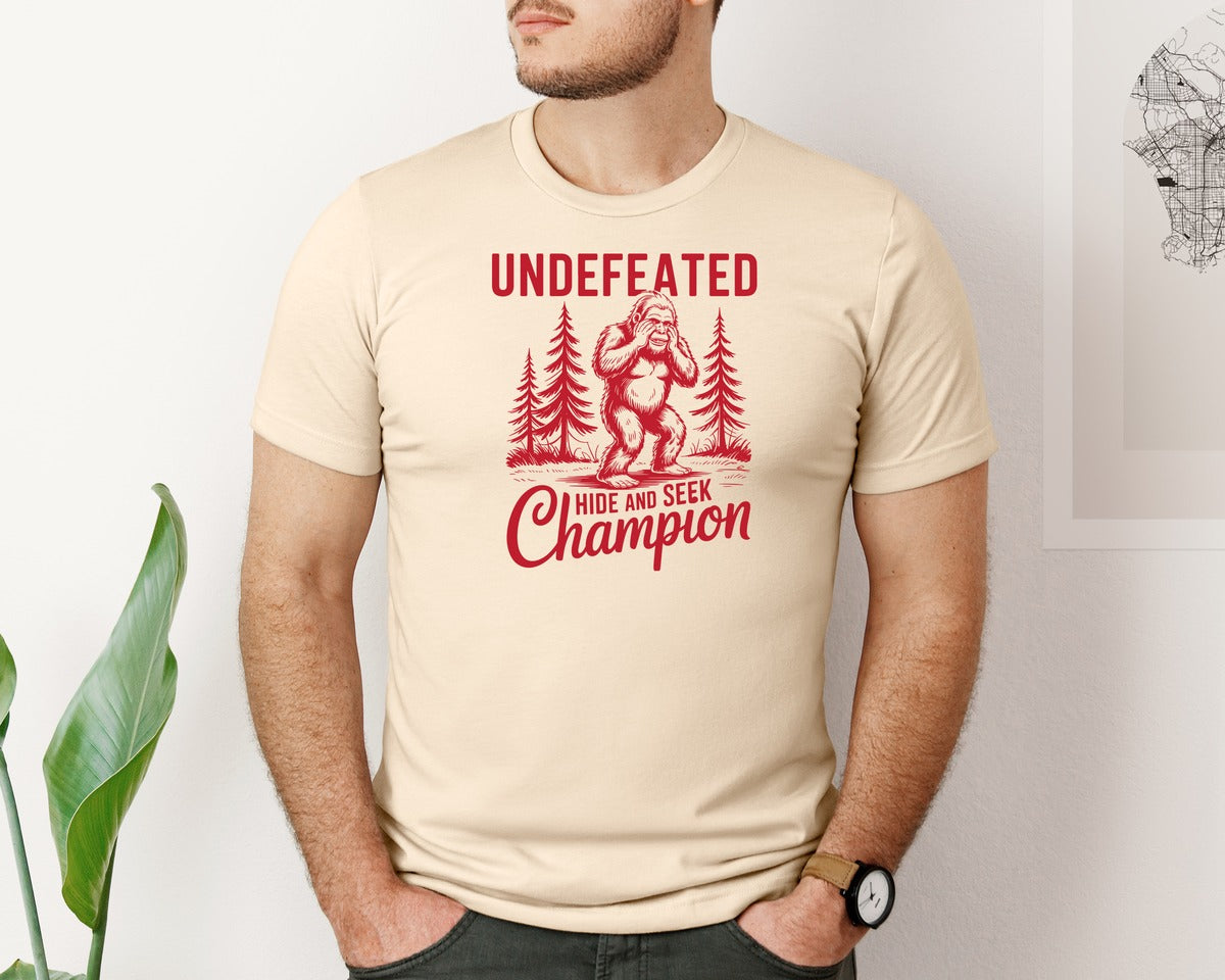 brand:Bella Canvas|color:Soft Cream|Bigfoot Undefeated Hide And Seek 2 Graphic T-Shirt