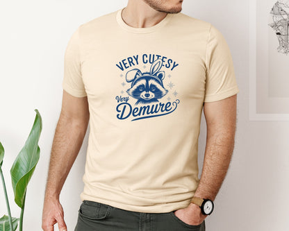 brand:Bella Canvas|color:Soft Cream|Very Cutesy Very Demure Raccoon T Shirt Graphic T-Shirt