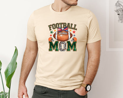 brand:Bella Canvas|color:Soft Cream|Coquette Football Mom Leopard Mascot Graphic T-Shirt
