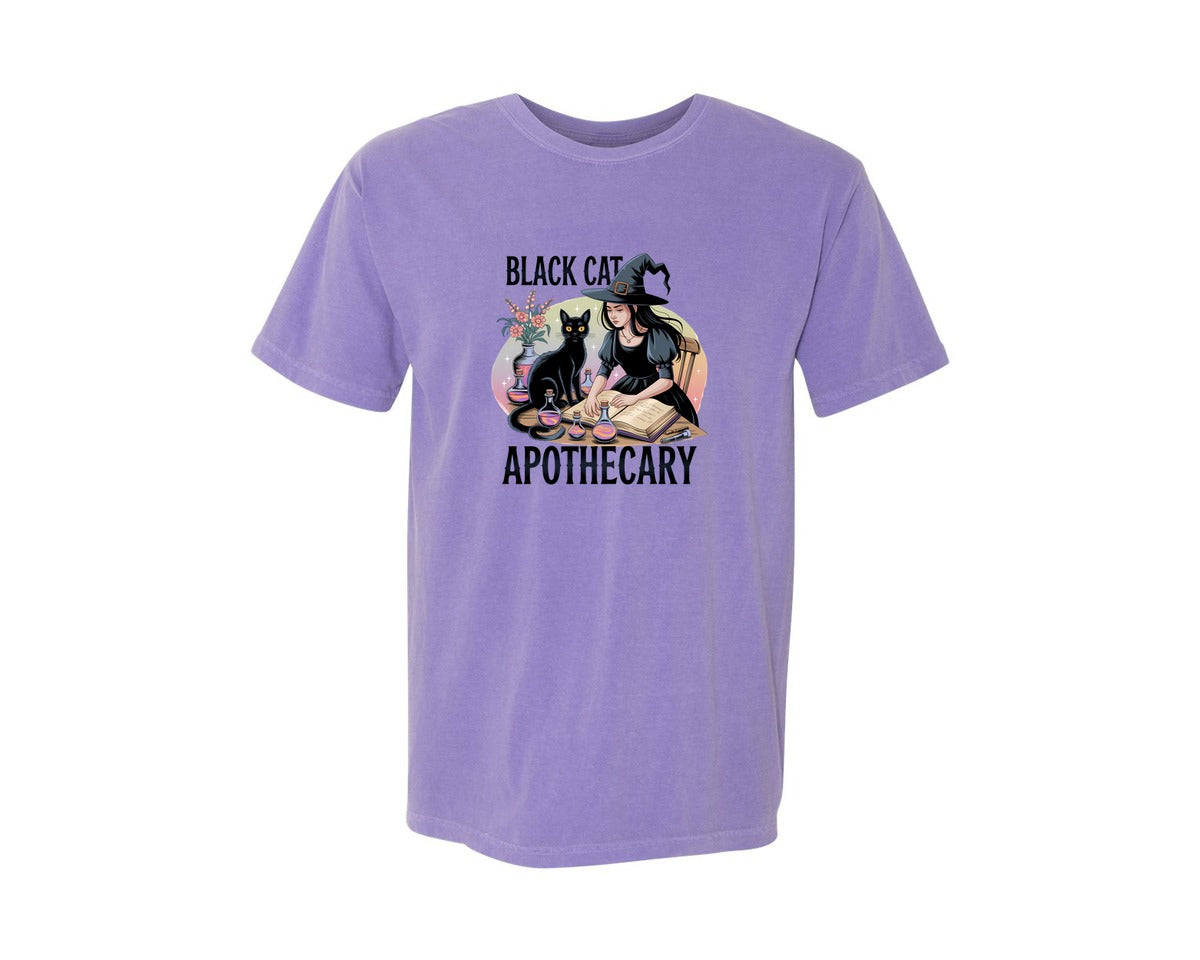 brand:Comfort Colors|color:Violet|Black Cat Apothecary Witchy Book 7 Graphic T-Shirt