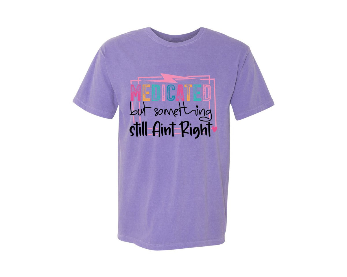 brand:Comfort Colors|color:Violet|Medicated But Somethin Aint Right Snarky Graphic T-Shirt