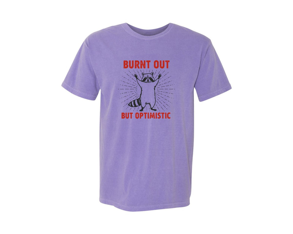 brand:Comfort Colors|color:Violet|Burnt Out But Optimistic Raccoon Graphic T-Shirt