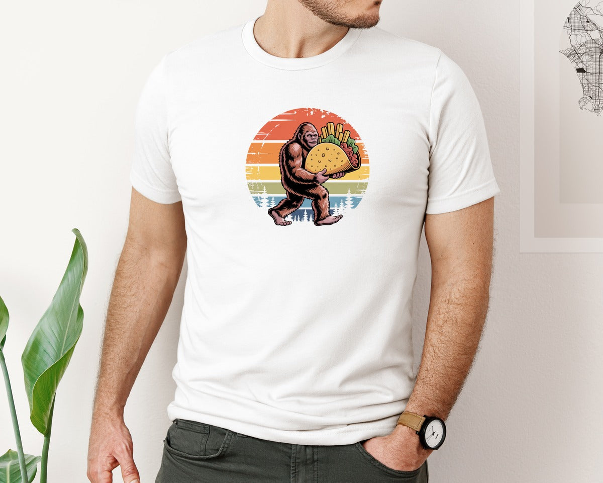 brand:Bella Canvas|color:White|Funny Bigfoot Taco Retro Sunset Graphic T-Shirt