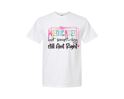 brand:Comfort Colors|color:White|Medicated But Somethin Aint Right Snarky Graphic T-Shirt