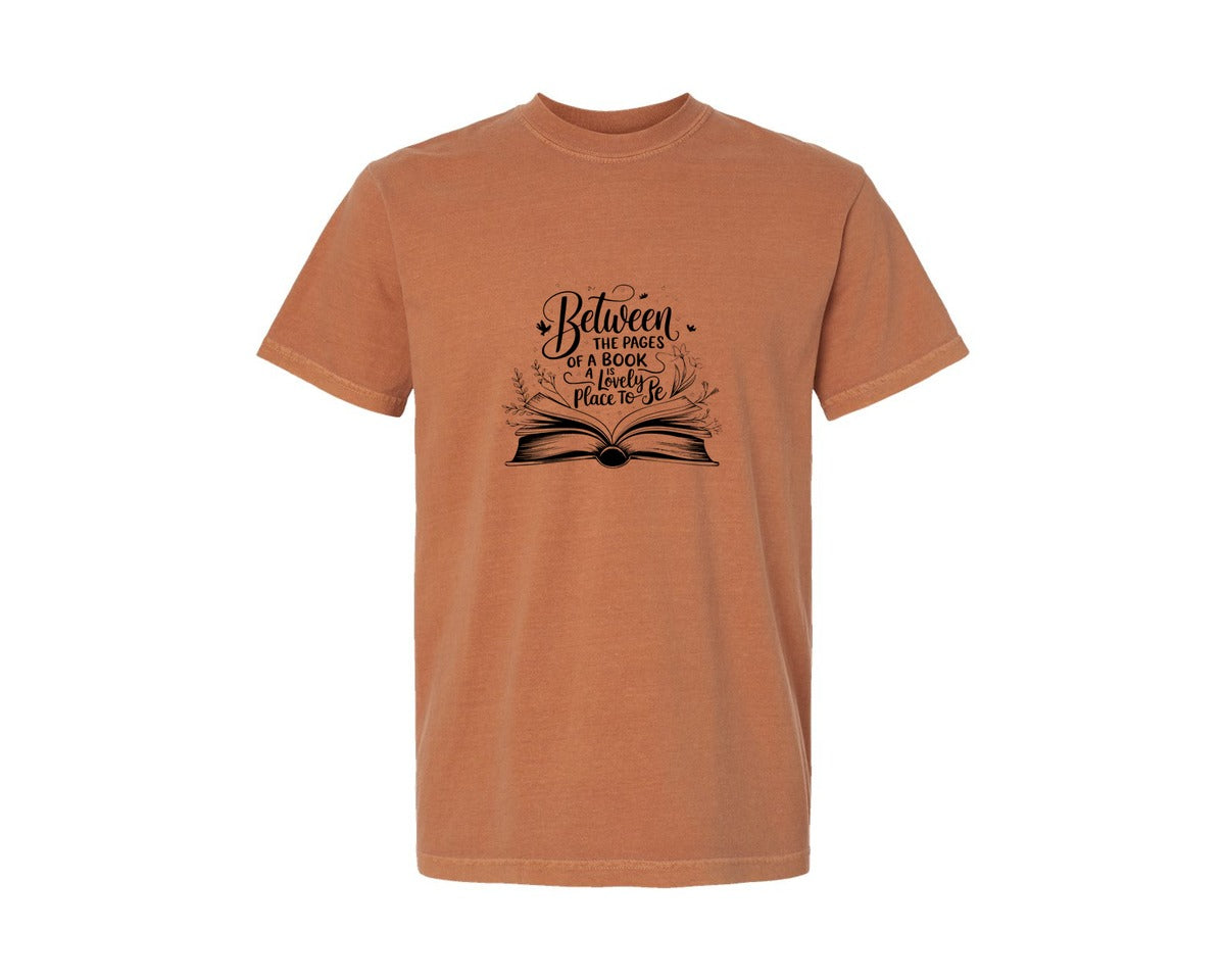 brand:Comfort Colors|color:Yam|Between The Pages Of A Book Is A Lovely 24 Graphic T-Shirt