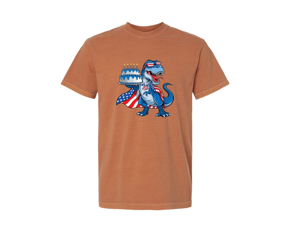 brand:Comfort Colors|color:Yam|T Rex Holding Birthday Cake Dinosaur Usa Graphic T-Shirt