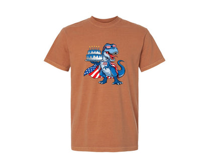 brand:Comfort Colors|color:Yam|T Rex Holding Birthday Cake Dinosaur Usa Graphic T-Shirt