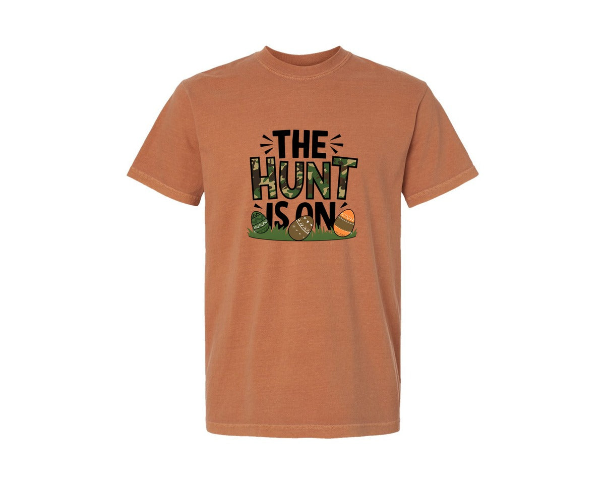 brand:Comfort Colors|color:Yam|The Hunt Is On Camo Easter Egg Camo Graphic T-Shirt