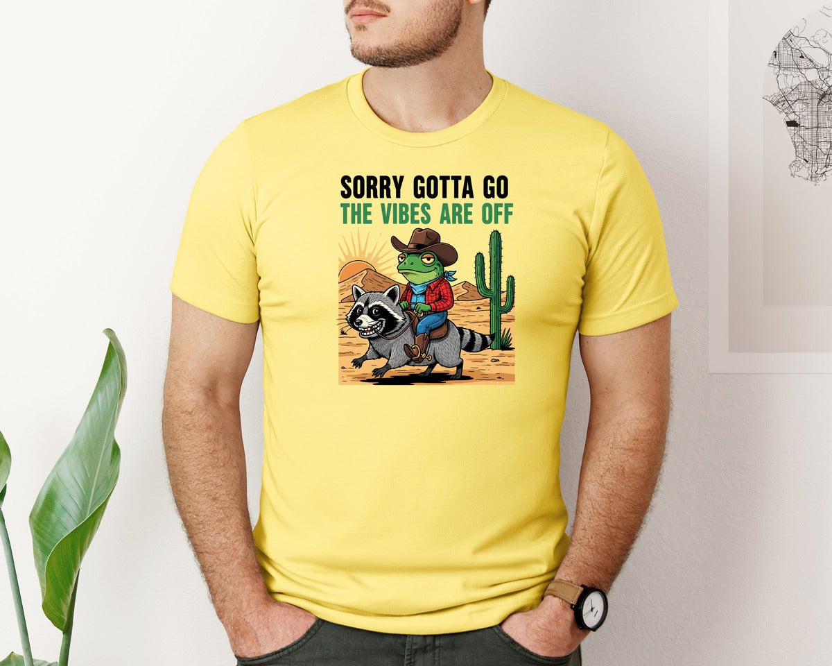brand:Bella Canvas|color:Yellow|Sorry Gotta Go Cowboy Frog Raccoon Graphic T-Shirt